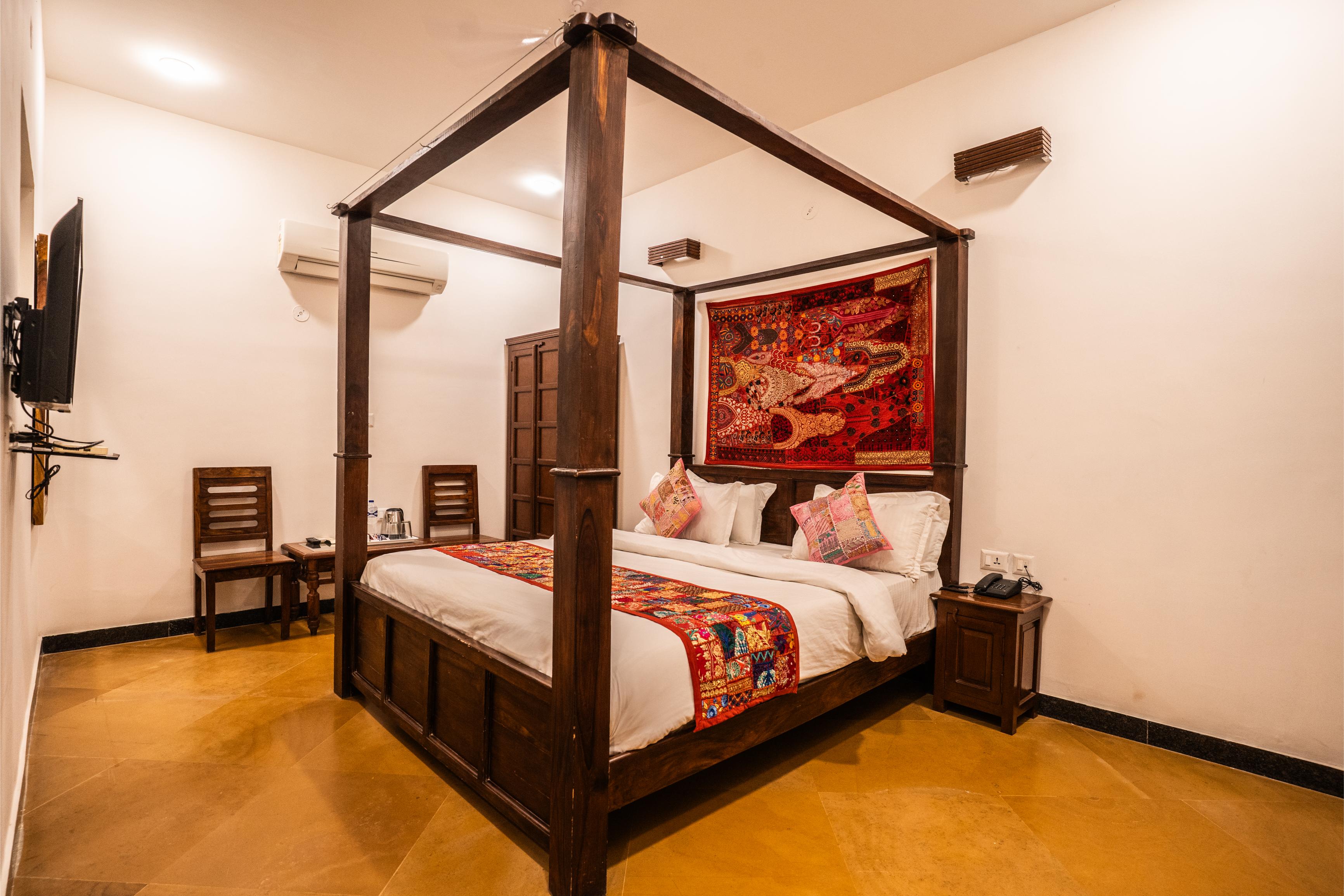 Hand-carved wooden furniture in the Heritage Suite, Luxoria Jaisalmer