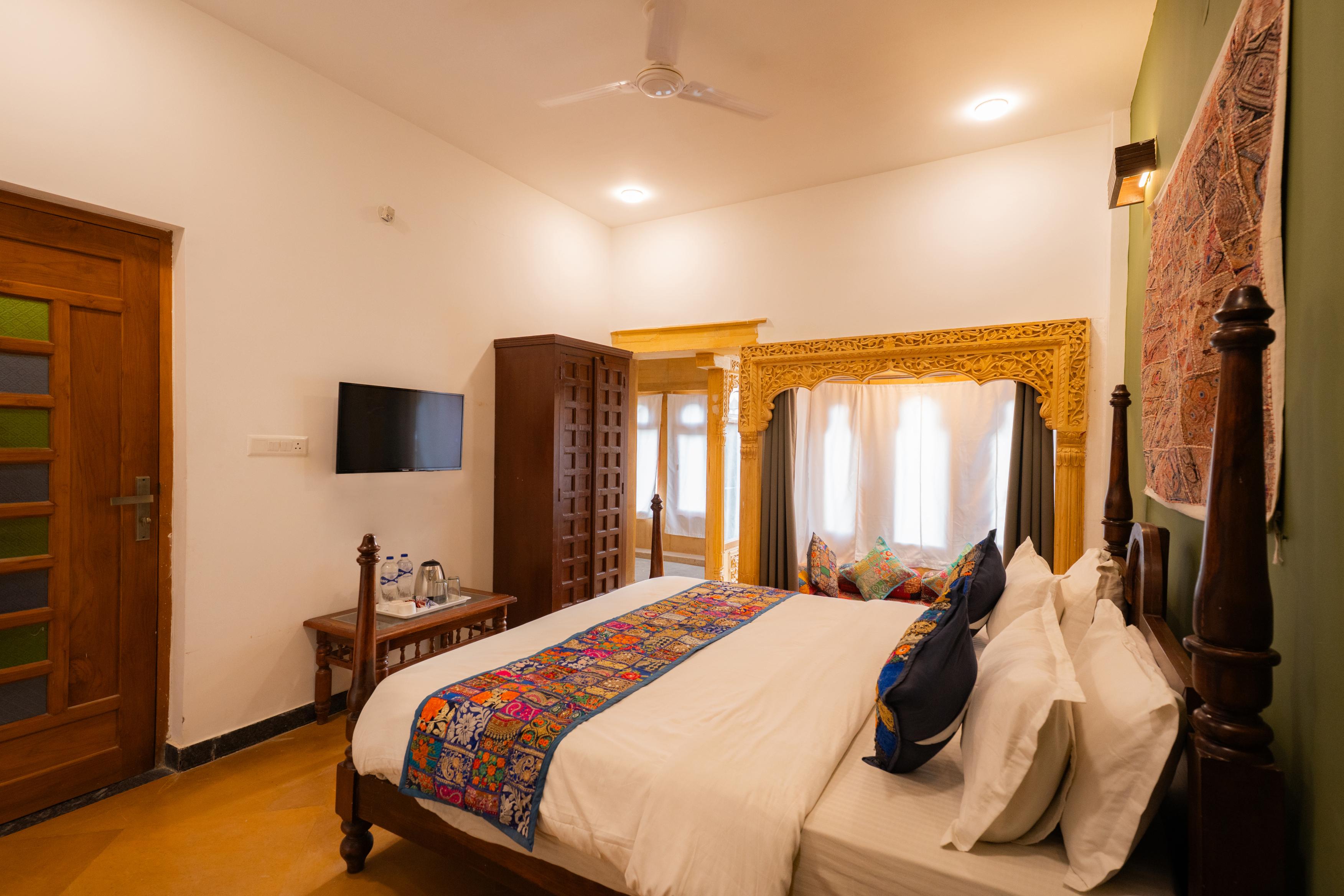 Heritage Suite interior with Rajasthani textiles and carved woodwork