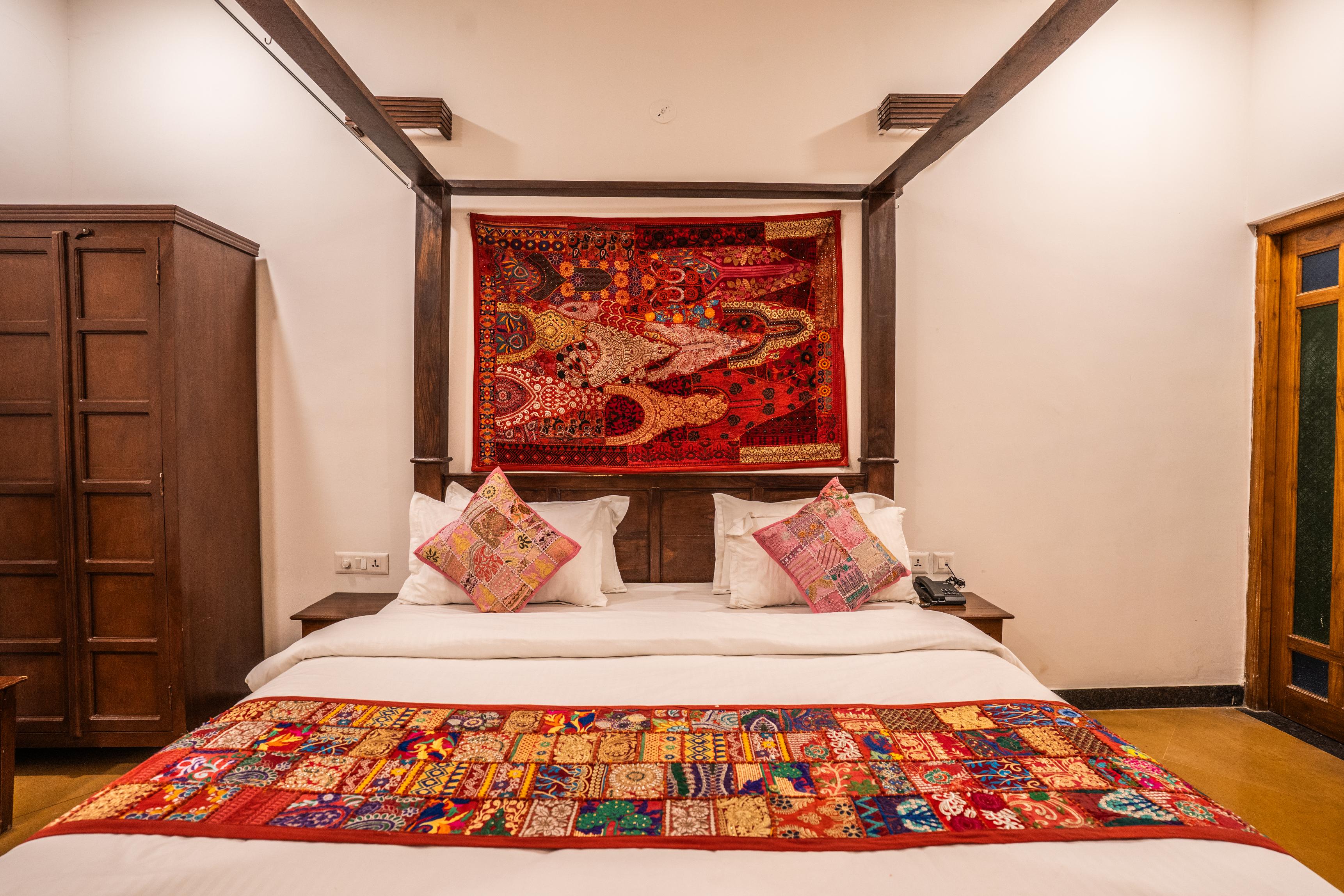 King bed and seating in the Super Deluxe Room, Luxoria Jaisalmer